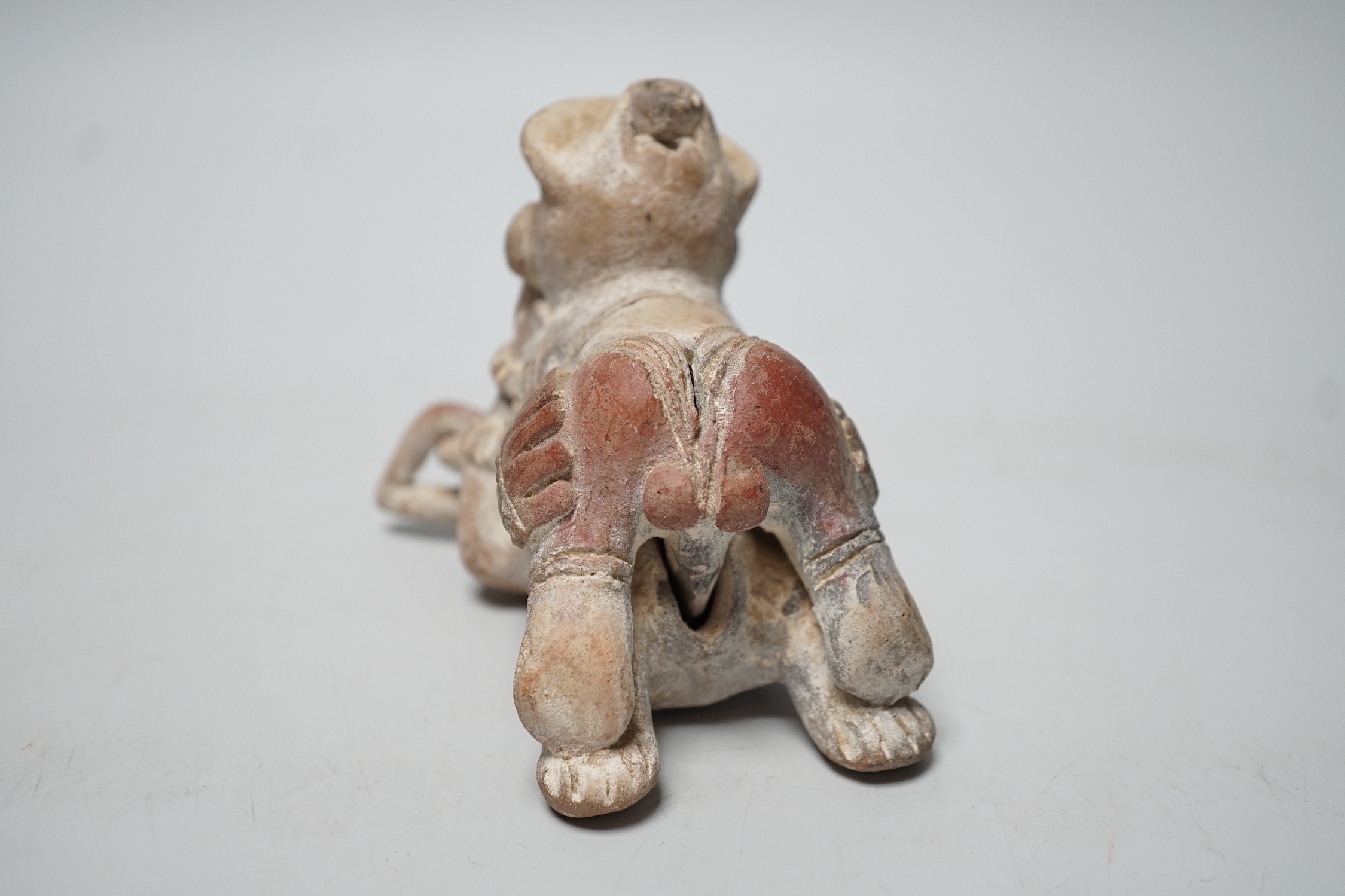 A Mayan or later biscuit earthenware erotic novelty whistle, 12cm long